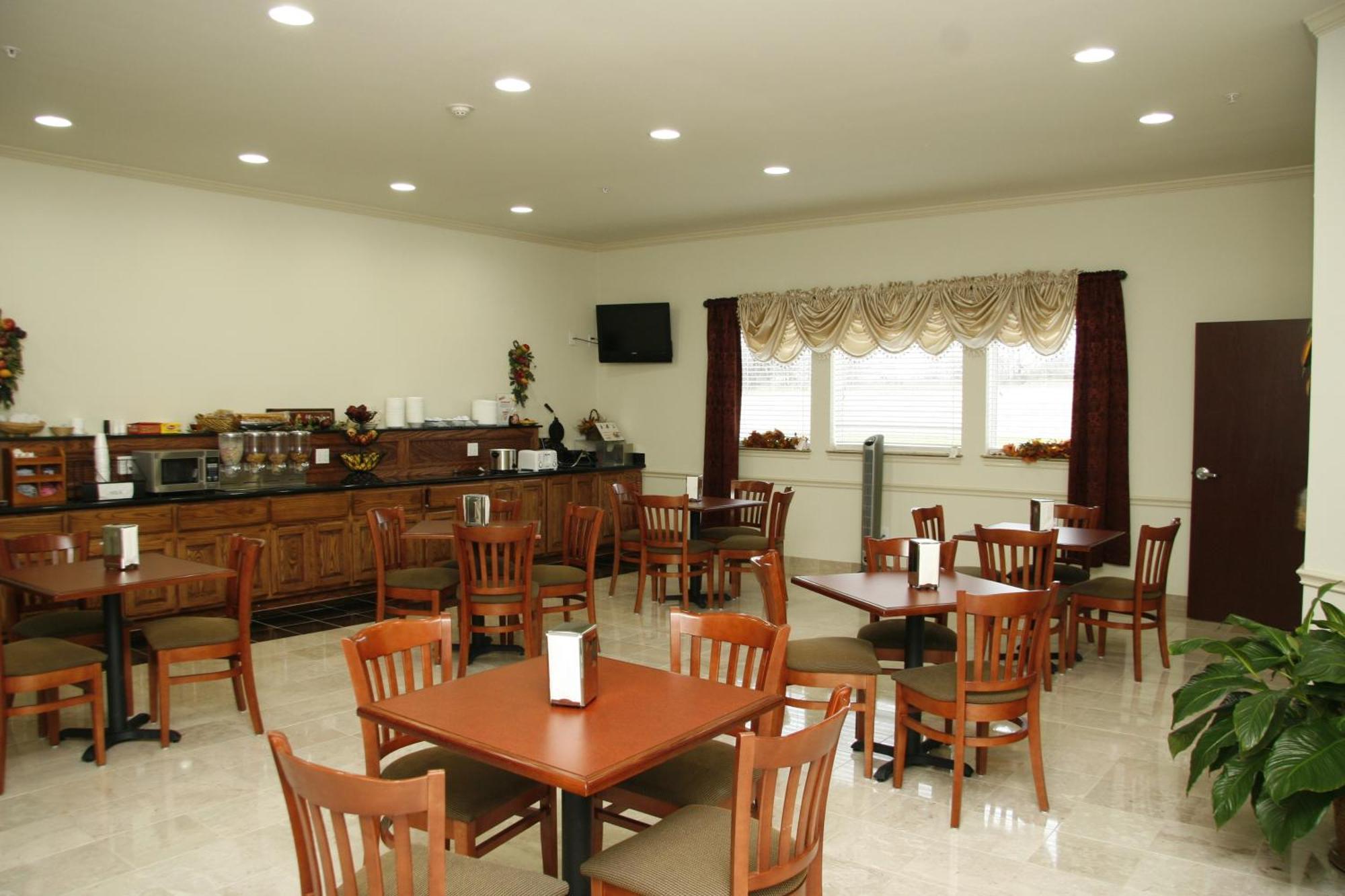 Budget Host Inn And Suites Cameron Quarto foto